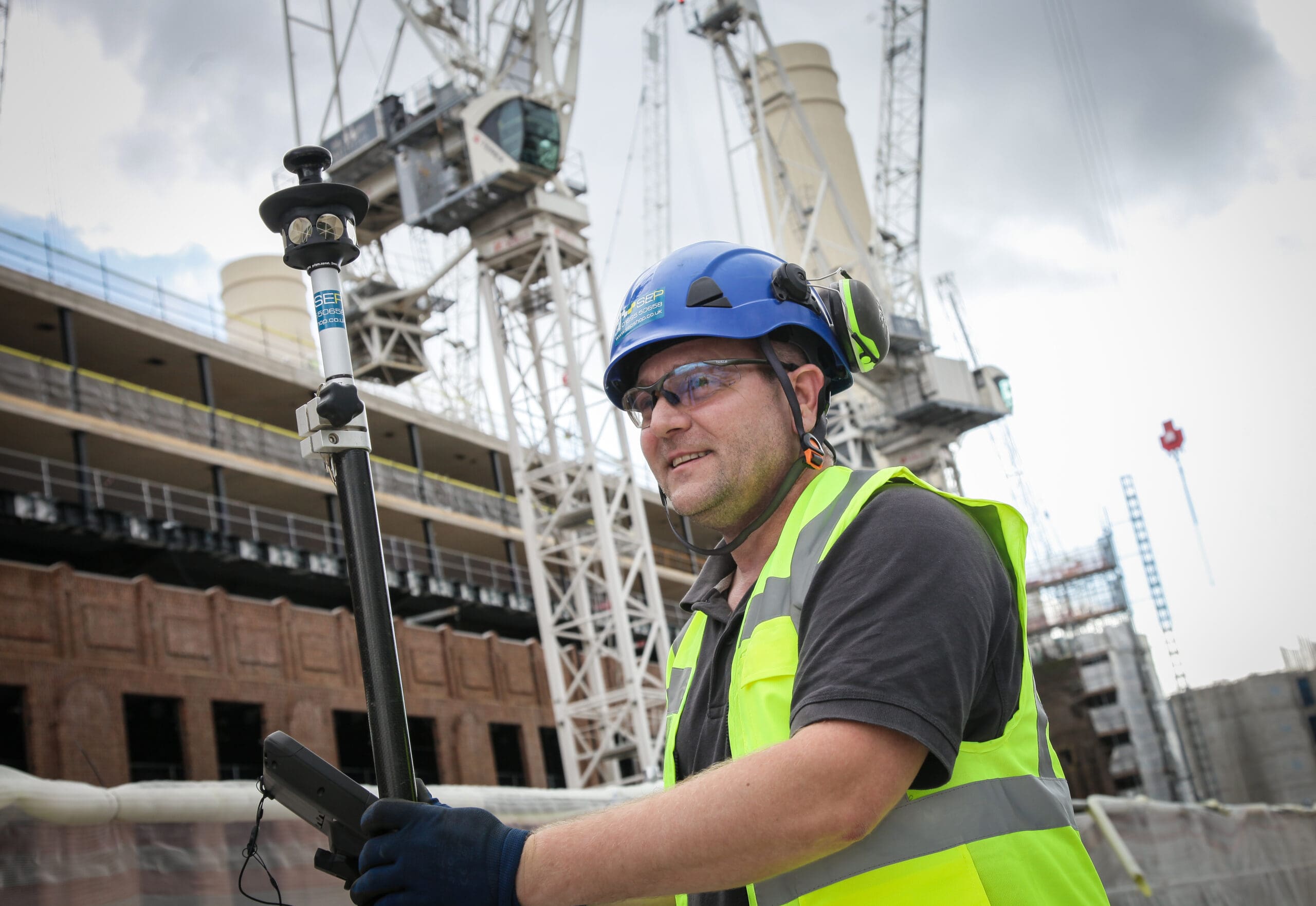 Setting out engineer working on site layout in North London